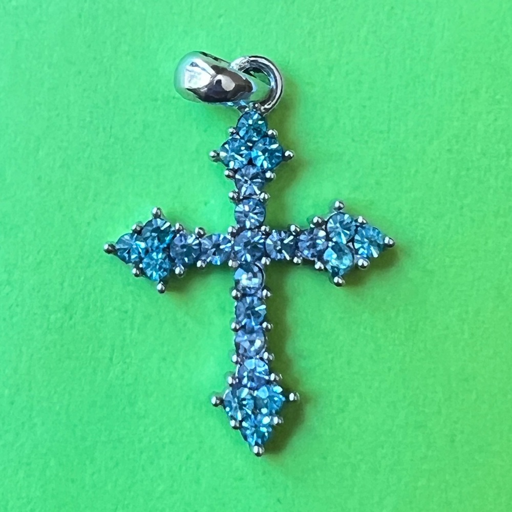 Silver tone blue rhinestone ornate cross pendant